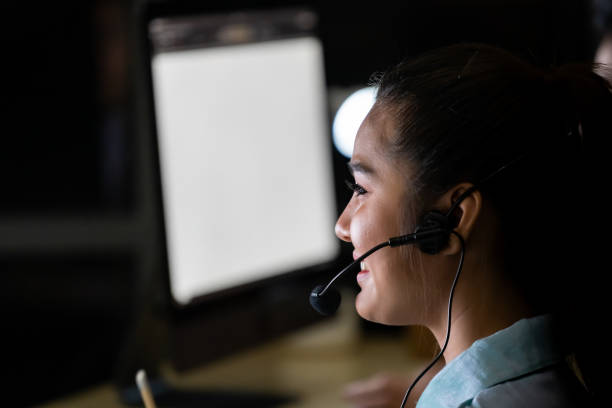 Call centre working at night stock photo