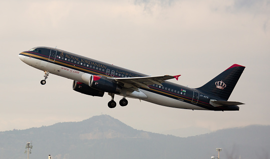 BARCELONA, SPAIN - JANUARY 26, 2020: View of JY-AYX Airbus A320 of Royal Jordanian Airlines flies up from Barcelona Airport (BCN)