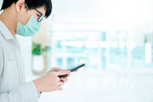 istock Male patient using smartphone in hospital 1207309811
