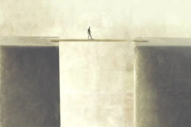 man walking on a tiny bridge