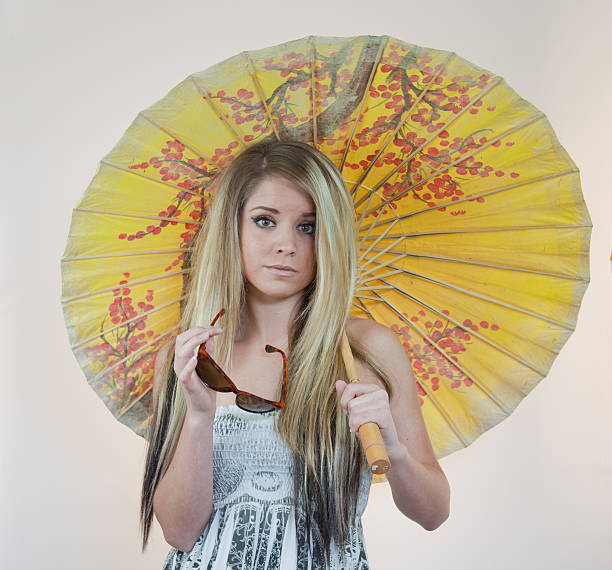 istock Beaautiful Blond With Parasol And Sunglasses 120731034