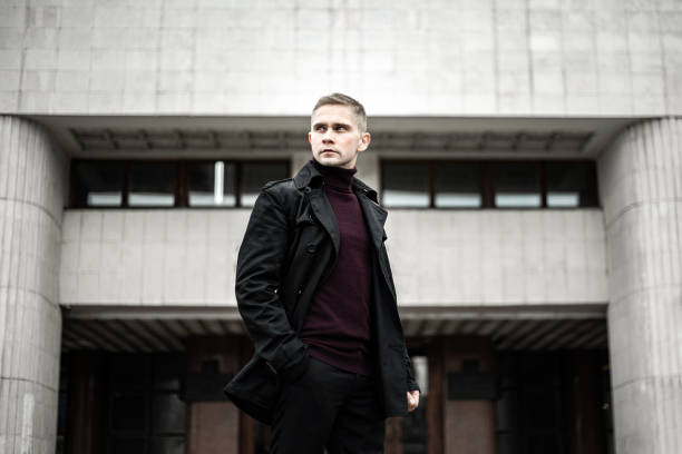 istock Stylish man in black trenchcoat 1207311818