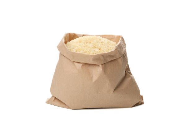 istock Paper bag with rice isolated on white background 1207312887