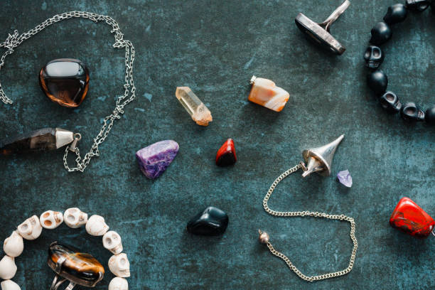istock Magic flat lay. Various precious and semiprecious stones on a blue background for witchcraft. 1207314266