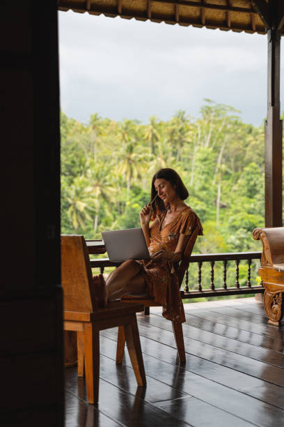 istock Young brunette woman doing her job on distance 1207317556