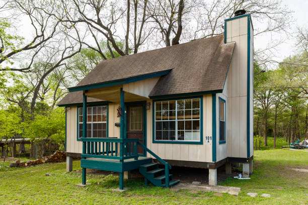 Tiny Home Wimberley, Texas USA - April 6, 2016: Beautiful tiny cottage wood frame home in the residential area of this small rustic town in the Texas Hill Country in Hays County in central Texas. tiny house stock pictures, royalty-free photos & images