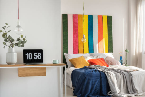 istock Open space bedroom and home office interior with bed and desk 1207319264