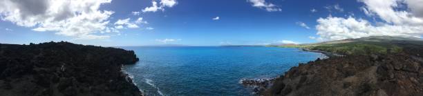 istock hiking on lava and ocean view 1207319355