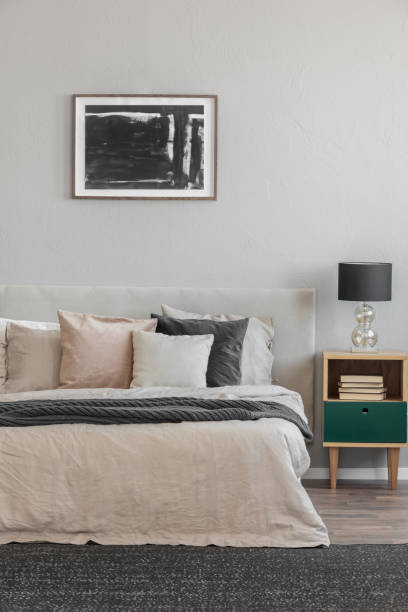 istock Trendy bedroom with comfortable king size bed in modern flat, real photo 1207320908