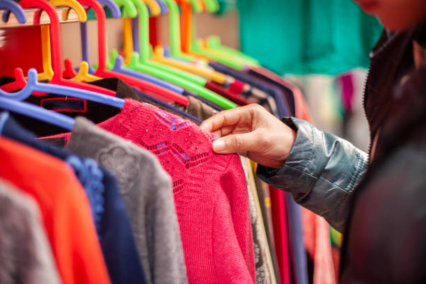 istock Hand choosing clothes for shopping. 1207321461