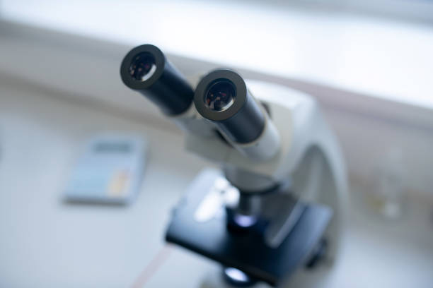 istock Close up picture of a microscope on the table 1207325464