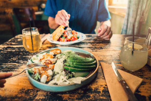 istock Couple eating healthy lunch at restaurant 1207329169