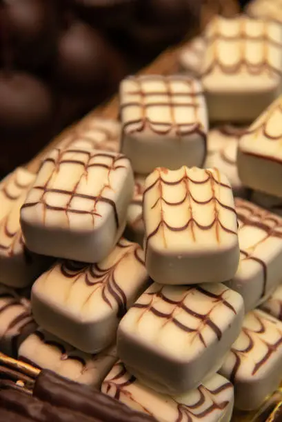 Group of delicious and tasty sweet bar of white chocolates at a confectionery.