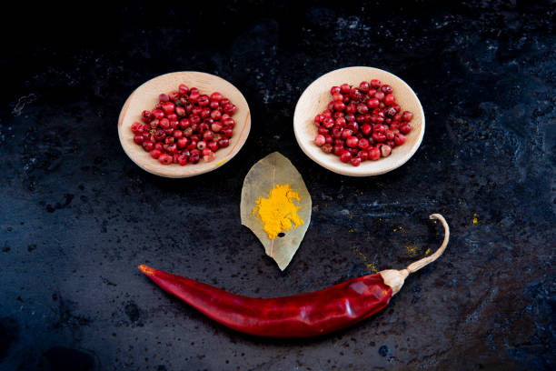Healthy nutritious dry and spicy red peepers and spices for a seasoning and flavouring on salad and food.