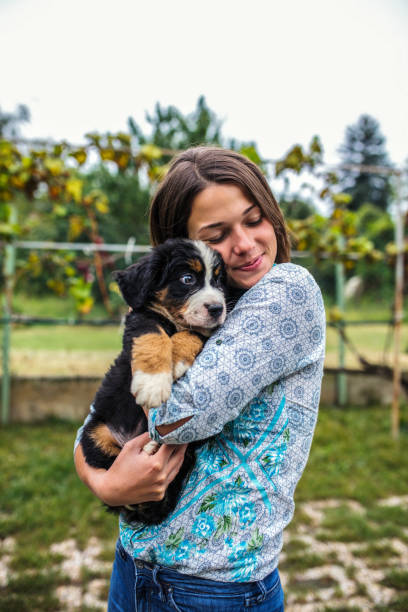 istock Young Woman with lovely puppies 1207334621