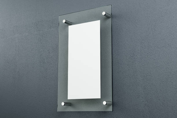 istock Glassy signboard on gray concrete wall 1207337158