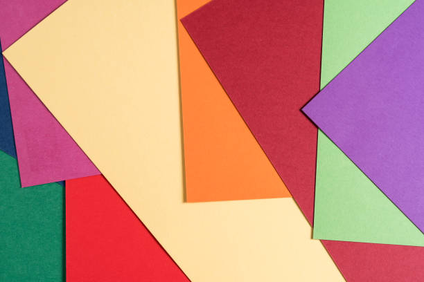 istock Multi colored abstract paper of pastel colors, with geometric shape, flat lay. 1207337358