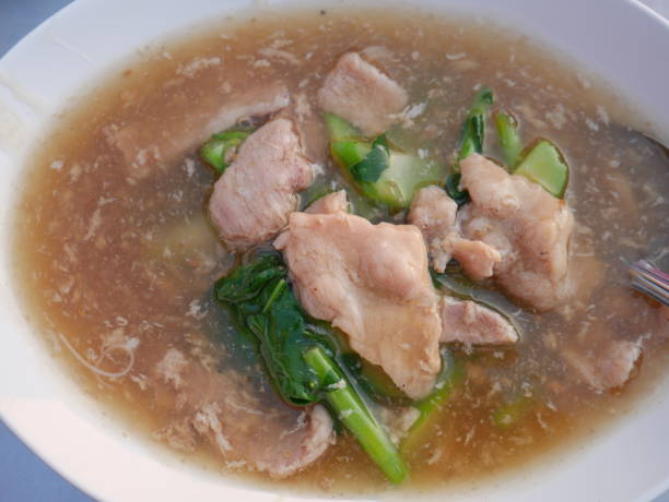istock Stir-fried noodles with pork in gravy sauce 1207337667