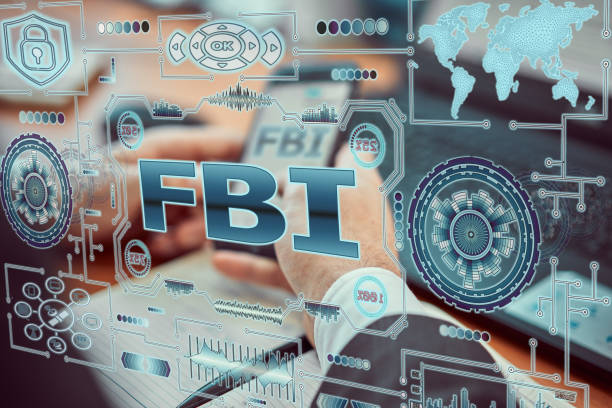 A young agent a futuristic smartphone with the latest holographic technology augmented reality with the inscription "fbi". A young agent a futuristic smartphone with the latest holographic technology augmented reality with the inscription "fbi". fbi photos stock pictures, royalty-free photos & images