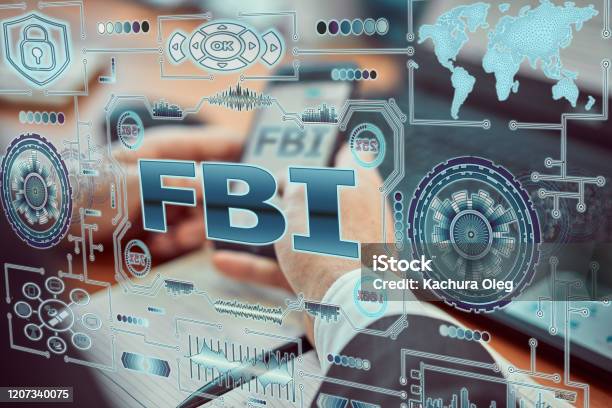 A Young Agent A Futuristic Smartphone With The Latest Holographic Technology Augmented Reality With The Inscription Fbi Stock Photo - Download Image Now