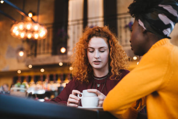 istock A young woman is talking with a female friend about her problem in a cafe. 1207340113