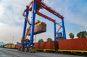 Cargo train platform with freight train container in a port for export logistics.
