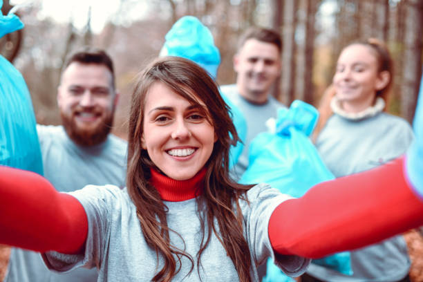 istock Environmental Volunteers Taking A Selfie With Plastic Bags 1207343968