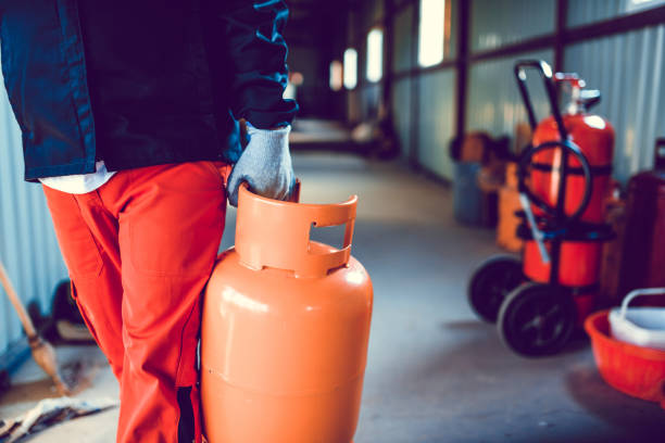 istock Male Working Taking Gas Cylinder For Checkup 1207345054