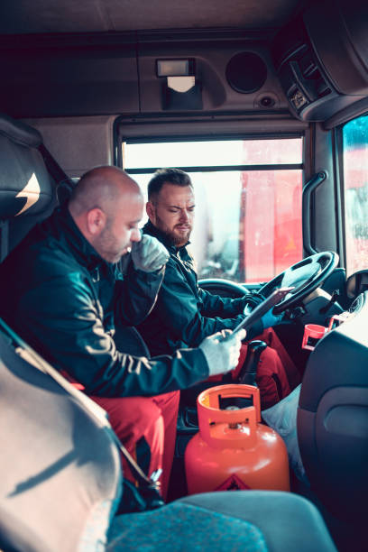 istock Gas Tanker Truck Team Getting Ready For A Trip 1207345200