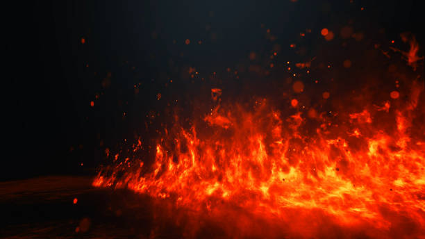 istock Red hot flames of fire isolated on black 1207345540