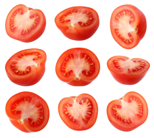 istock tomato halves isolated on a white background with a clipping path. 1207350954
