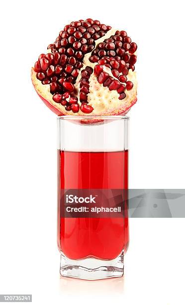 Glass Of Pomegranate Juice With Sliced Fruits Isolated Stock Photo - Download Image Now