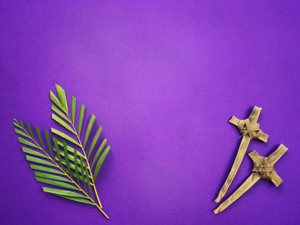 Good Friday, Lent Season and Holy Week concept. Palm leaves and crosses made of palm leaves on purple background. easter sunday photos stock pictures, royalty-free photos & images
