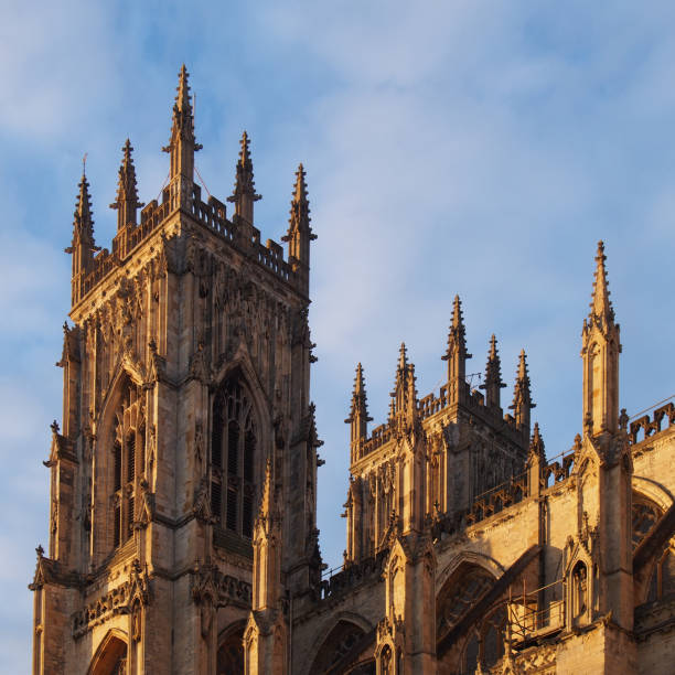 istock a side view of york minster in sunlight against a blue cloudy sky 1207355379