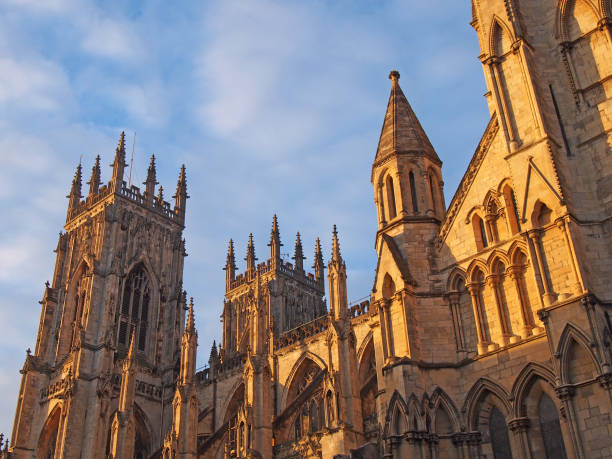 istock a side view of york minster in sunlight against a blue cloudy sky 1207355381