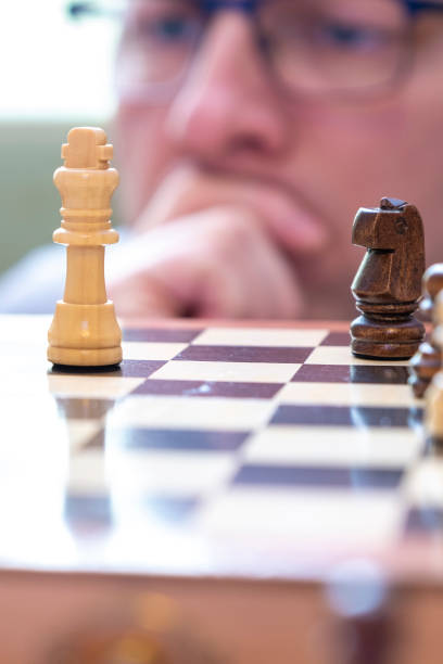 istock A man looks thoughtfully at chess pieces. 1207355433