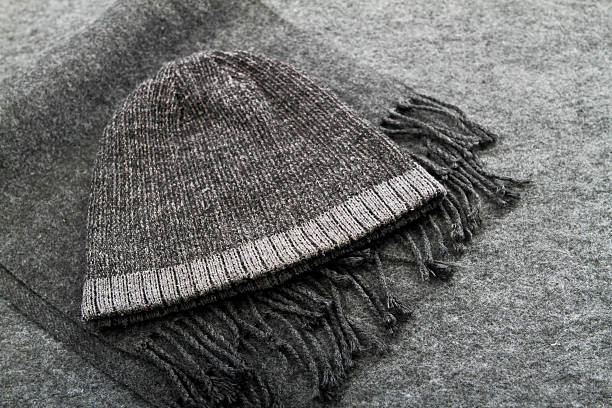 Wool hat on a scarf Wool hat on a scarf. toque stock pictures, royalty-free photos & images