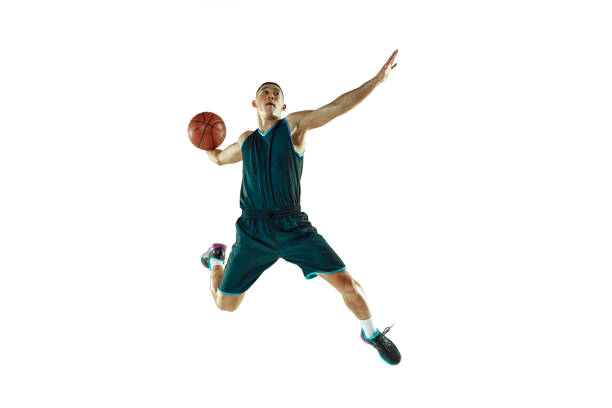 istock Young basketball player training isolated on white studio background 1207358151