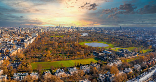 Beautiful aerial panoramic view of the Hyde park in London Beautiful aerial view of the Hyde park in London, UK. Magical sunset view over the park with London skyline on the horizon. hyde park london photos stock pictures, royalty-free photos & images