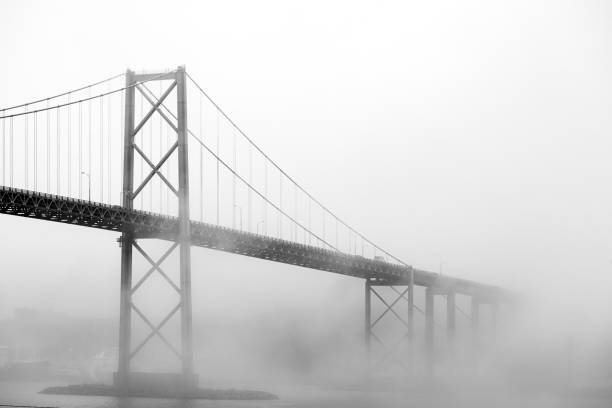 istock Bridge in Heavy Fog 1207360558