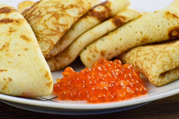 istock Traditional Russian pancakes with red caviar. 1207360785