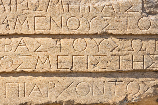 Greek letters carved on a stone on tablet at Miletus.