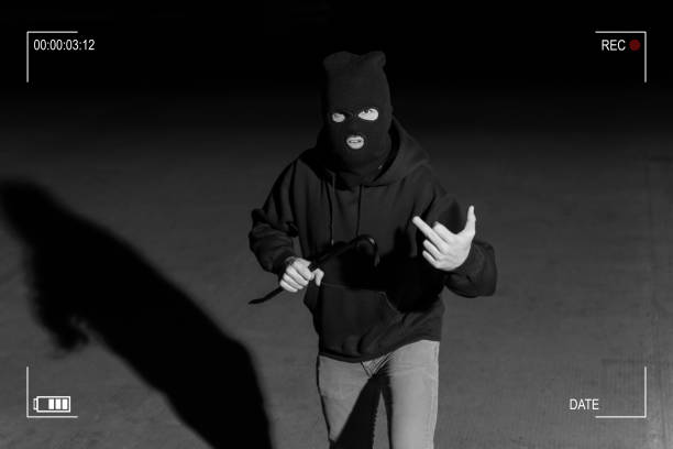 istock Surveillance Camera Caught Criminal In Dark Alley 1207364062