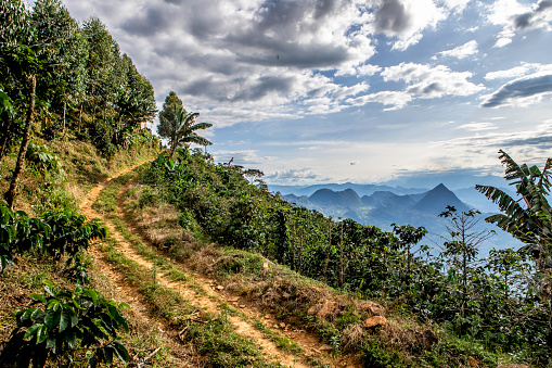 Colombian Mountain road on the face of a mountain overlooking mountain range outside Amaga Colombia