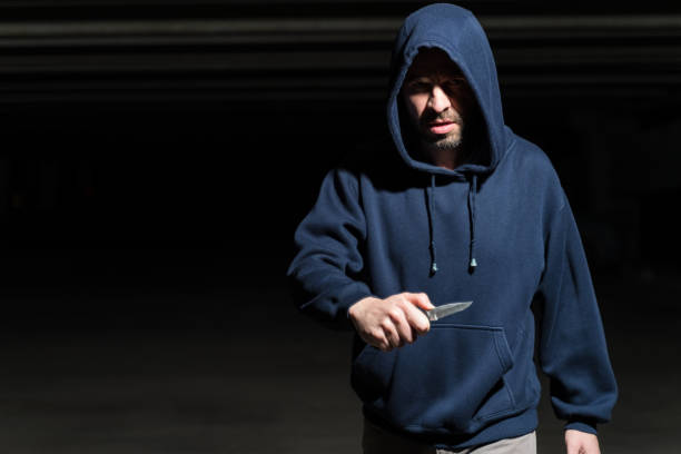istock Robber With Weapon Wearing Hoodie 1207364244