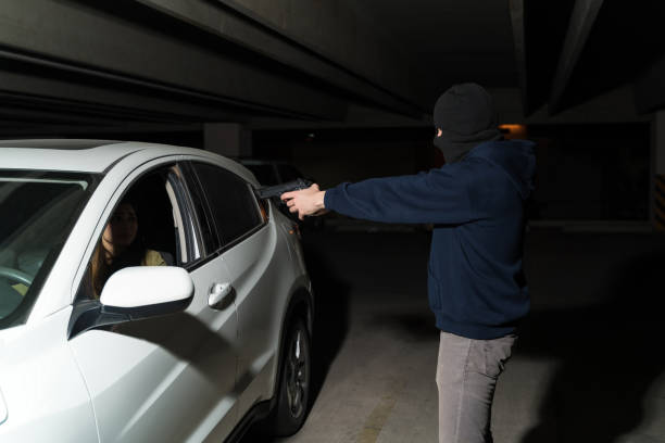 istock Criminal Scaring Victim At Dark Parking Lot 1207364924