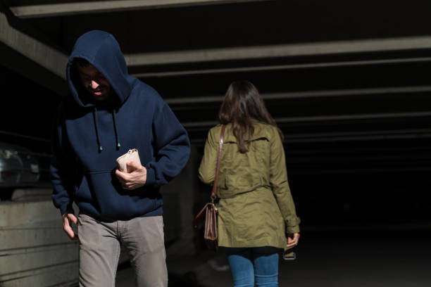 istock Thief Stealing From Female Victim 1207365025