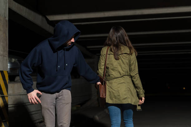 istock Thief Removing Wallet From Woman's Purse 1207365045