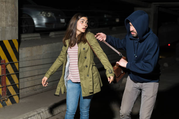 istock Criminal Committing Robbery In Parking Lot 1207365096