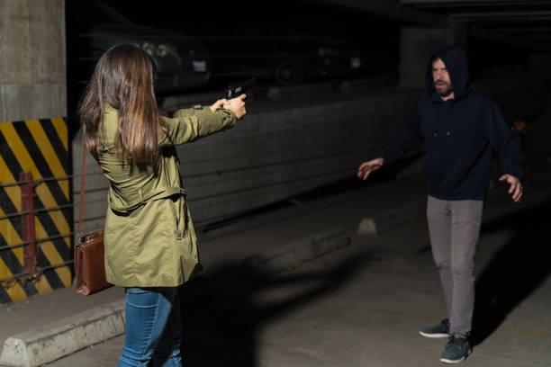 istock Bandit Shocked By Victim Pointing Weapon 1207365218